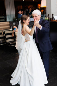 Emeline dances wtih her dad on her wedding day in Ottawa