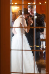 a beautiful wedding photograph through a window