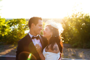 a couple kiss in the sunset at their ottawa wedding
