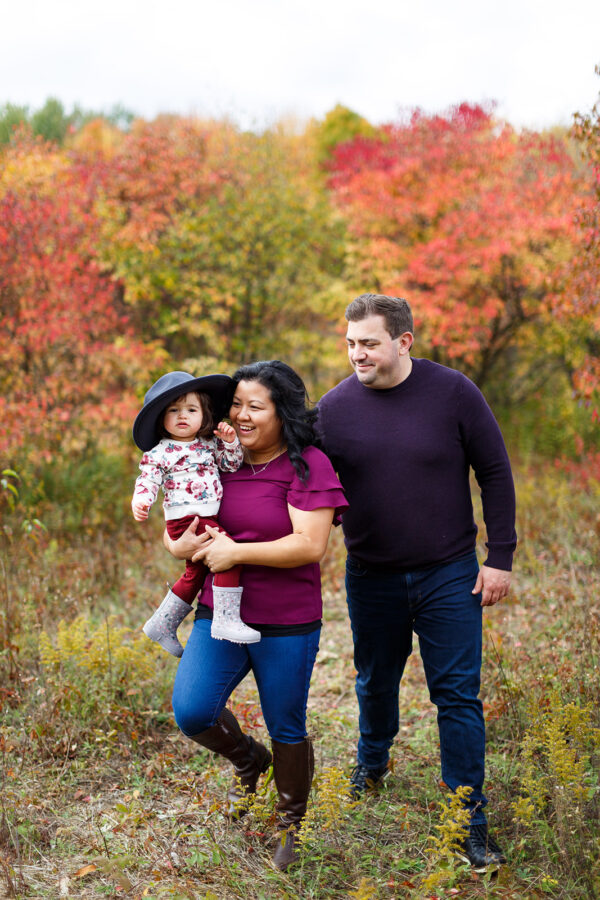 walking through fall foliage with one-year-old at Mer Bleue